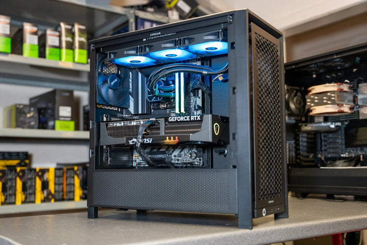 Ballista custom gaming PC built by Utopia Computers in the Kilmarnock workshop, showing internal components and RGB cooling fans.