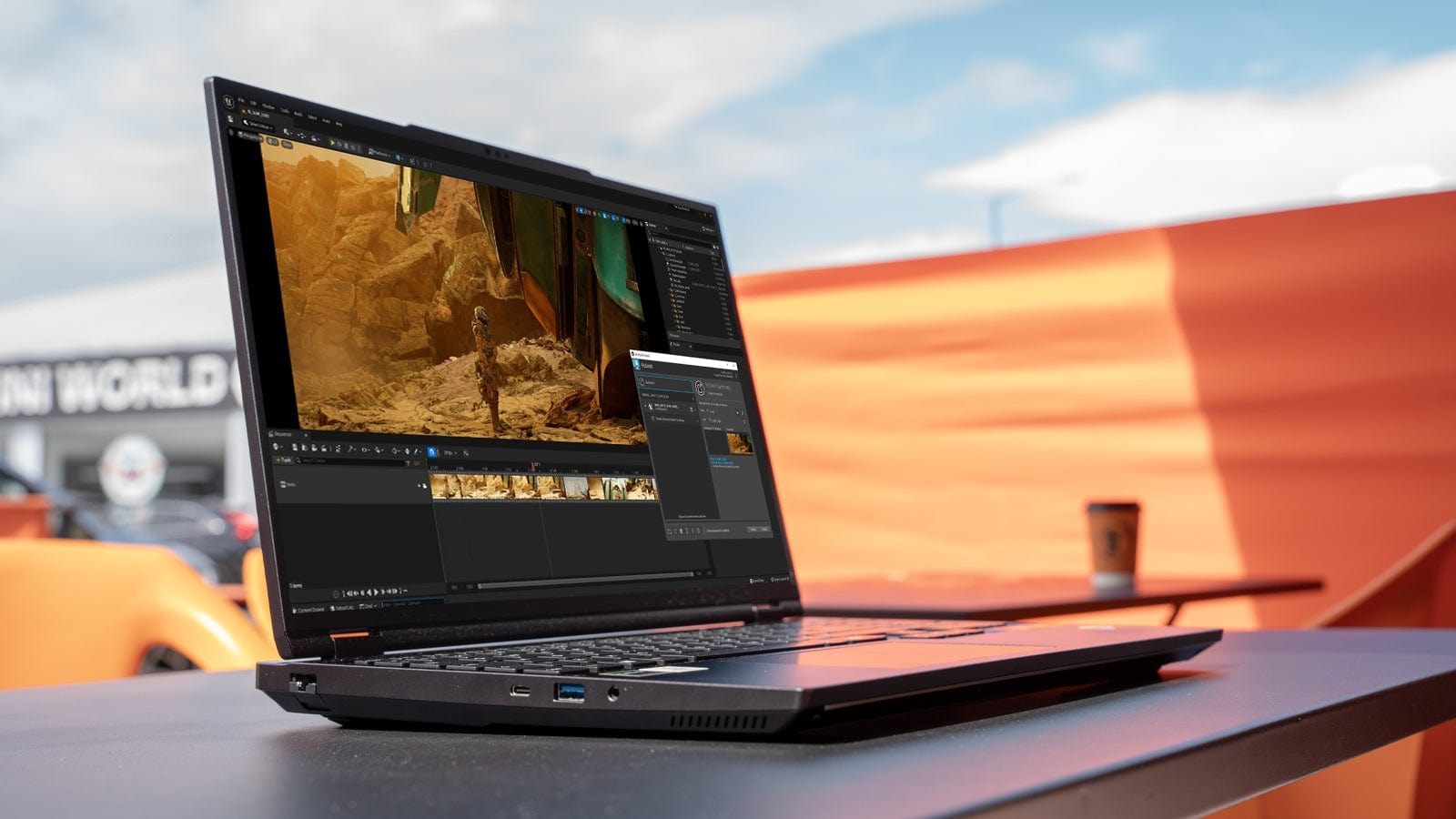 Mech 16 on a café table outdoors, editing video