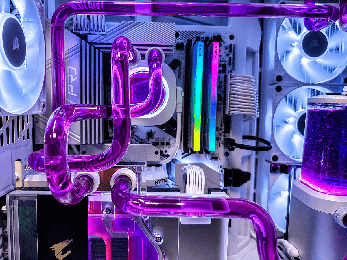 White Utopia Renegade custom water cooled PC with purple coolant in the Utopia workshop