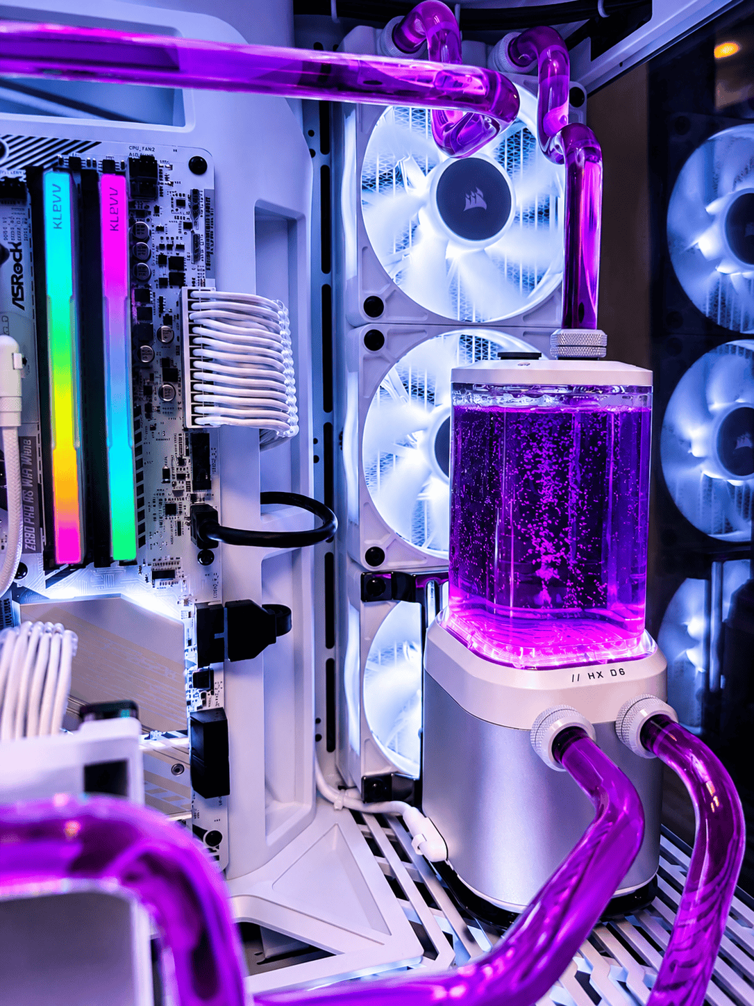 Low angle view of purple hardline tubing, CPU block and GPU block inside a Renegade