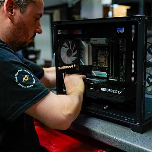 Utopia Technician building gaming PC in workshop